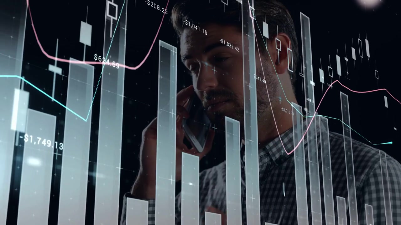 Trader raising phone to ear, studying overlaid finance charts with candlesticks, analyzing markets