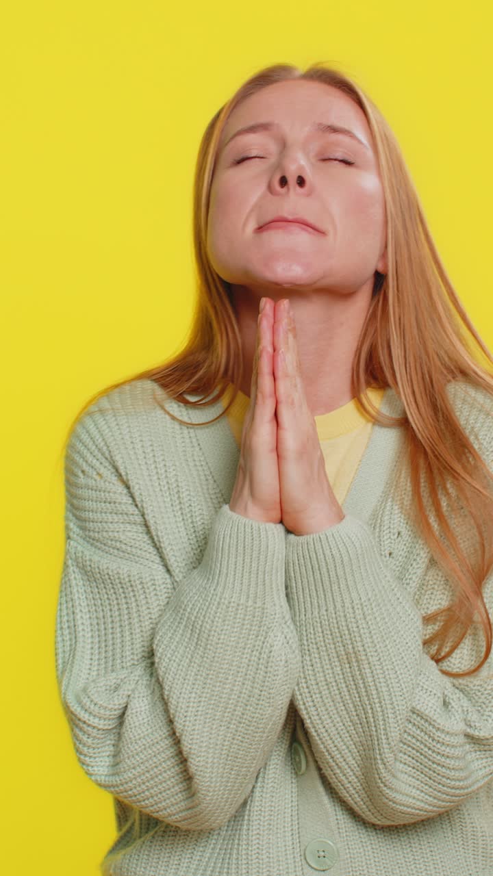 Middleaged woman praying making wish asking hopeful help begging apology meditation imploring