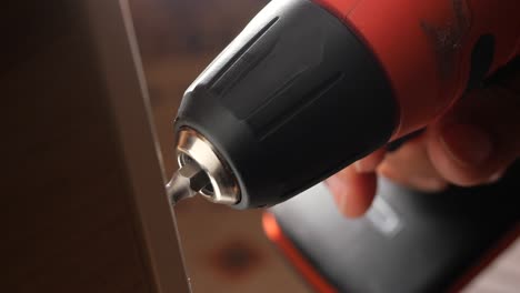 using a power drill to drive screws