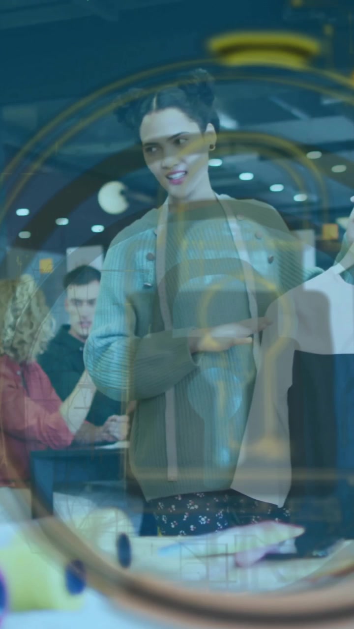 Lock symbol animation over diverse people collaborating in modern office setting
