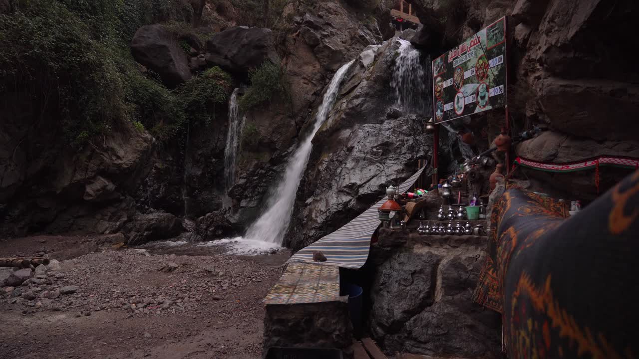 Wrapped in mist and surrounded by clouds, the Cascade Imlil offers a quiet, introspective moment at dusk, with nobody around to witness its serene beauty in Morocco