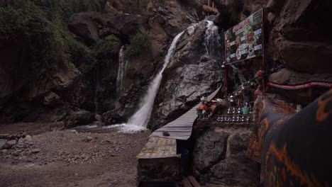 wrapped in mist and surrounded by clouds, the cascade imlil offers a quiet, introspective moment at dusk, with nobody around to witness its serene beauty in morocco