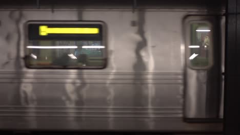 new york city subway arriving at station