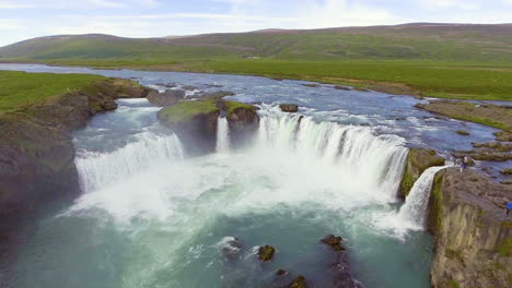 drone aerial footage of the godafoss waterfall in north iceland.