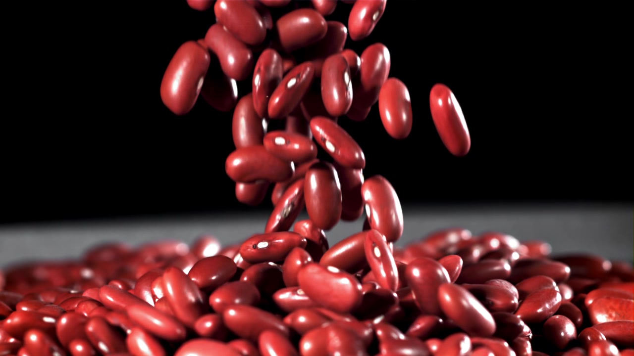 Red Kidney Beans Falling in Slow Motion onto a Pile