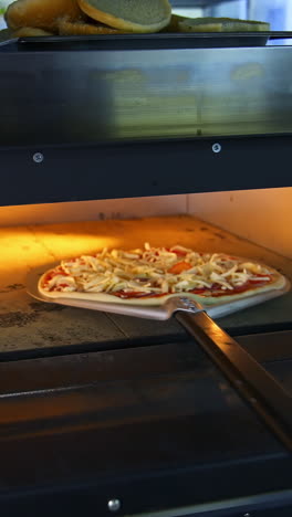 pizza being cooked in a commercial oven