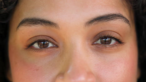 close-up of woman's eyes reflecting outdoor scenery, capturing natural beauty