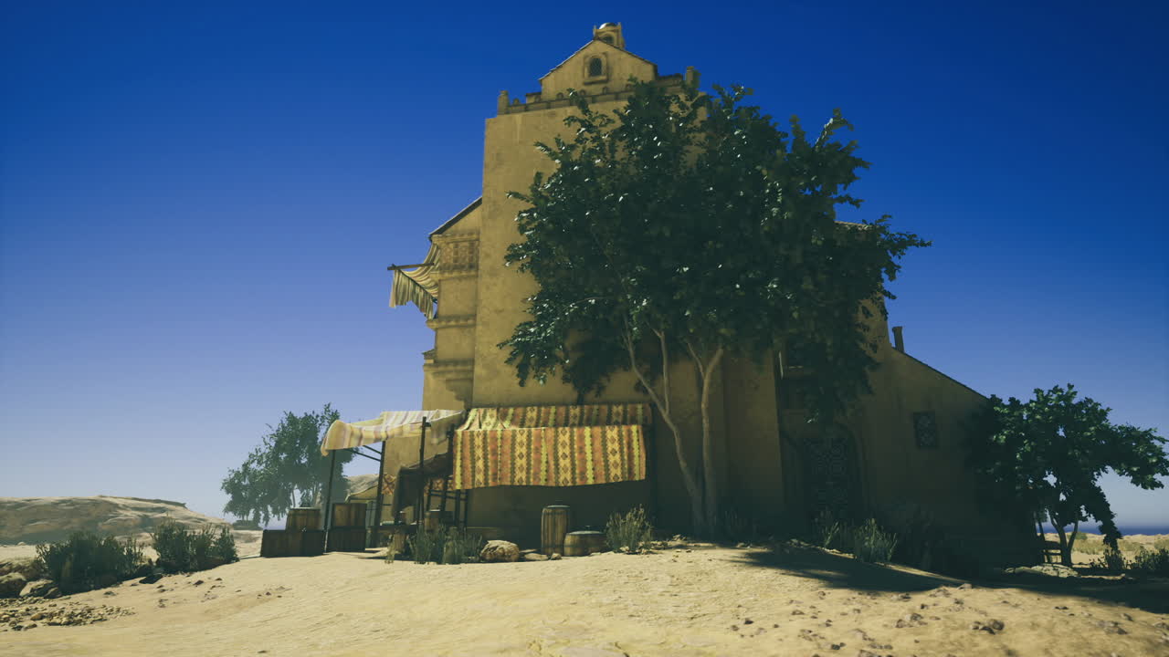 Residenza isolata immersa tra sabbie ventose e vegetazione minima, in solitudine.