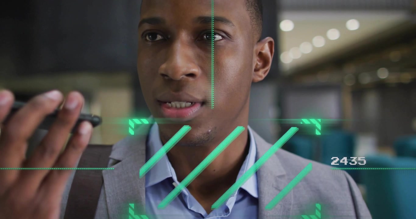 Animation of scope scanning over african american businessman talking on smartphone in office