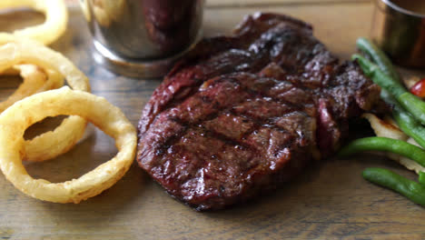 medium rare beef steak with vegetable and french fries