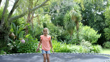 little girl enjoying on trampoline