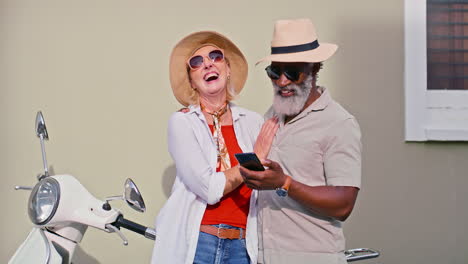 mature couple enjoying vacation with scooter