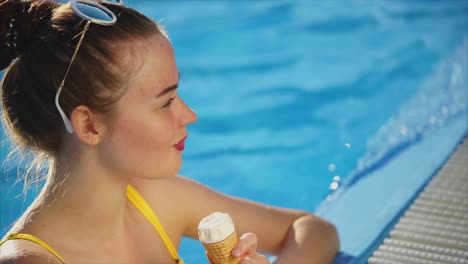 teenager enjoying ice cream by the pool