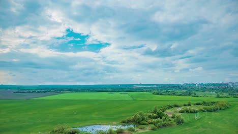 green fields and cloudy sky