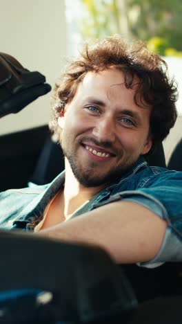 man smiling in a car
