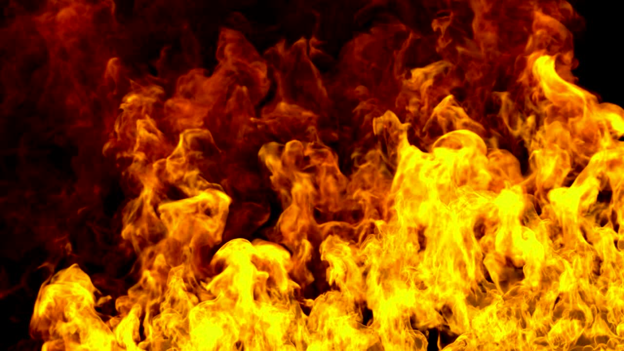 las llamas de fuego realistas queman movimiento en fondo negro bucle sin costuras listo