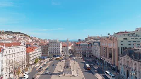 backwards shot of restauradores square at liberty avenue, lisbon, portugal