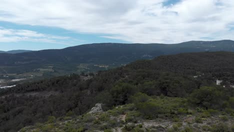 Bushes-on-the-rocky-mountainside-of-Alcoi,Valencia,Spain,aerial-shot