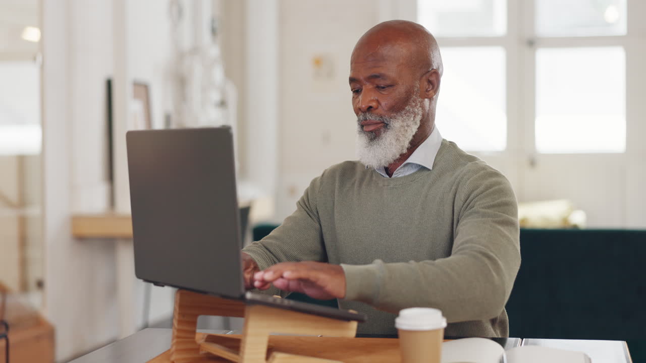 Laptop typing, black man and remote work in living