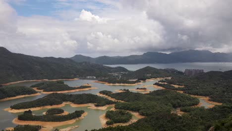 aerial flying over of tai lam chung reservoir in hong kong