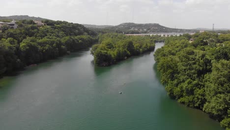 High-Flyover-drone-shot-of-redbud-isle-on-a-summer-day