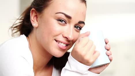 attractive-woman-drinking-coffee-at-home