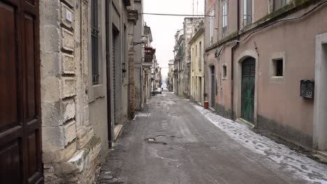 static view of back streets of guardiagrele in snow, abruzzo, italy