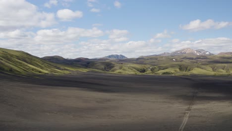 aerial panning shot of beautiful mountain landscape with highlands in iceland at sunlight