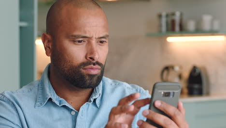 unhappy, phone and man texting on a sofa