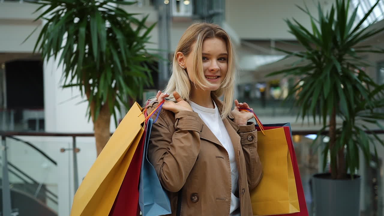 Woman with Shopping Bags in Mall