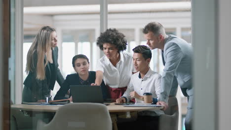 business people brainstorming using laptop computer team leader woman pointing at screen sharing creative ideas helping colleagues discussing project teamwork in modern office 4k