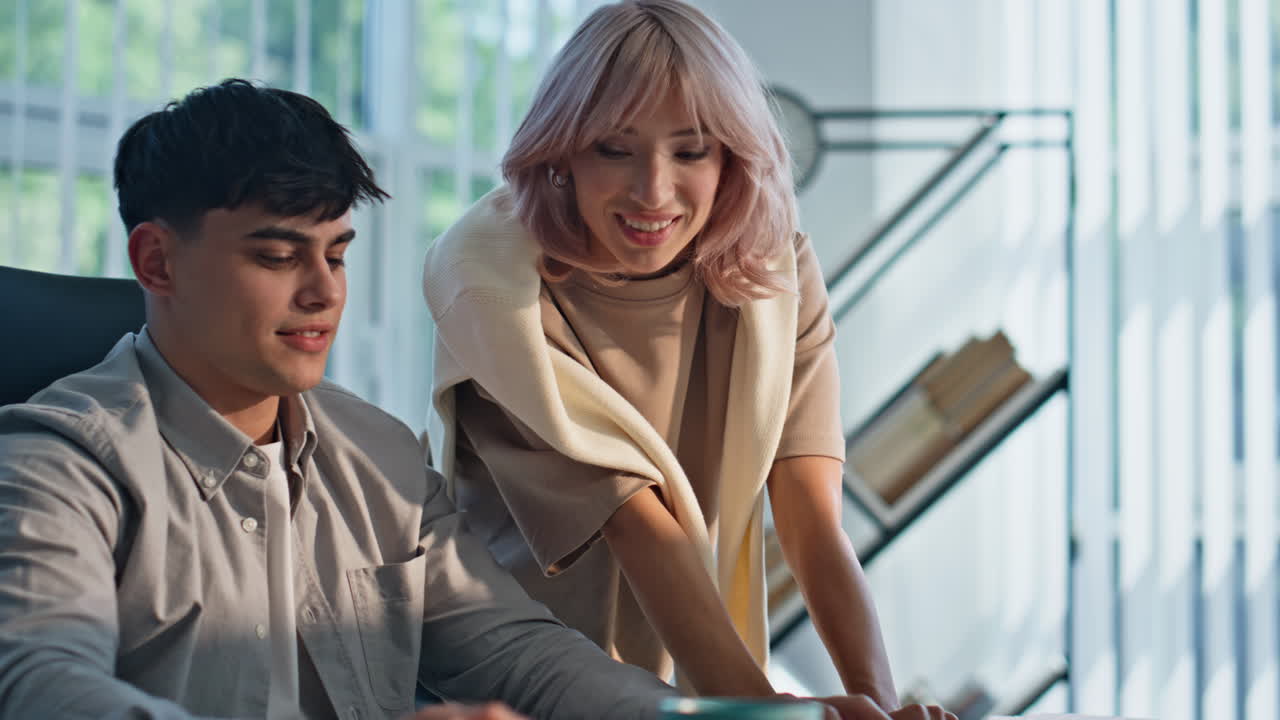 Focused colleagues looking monitor discussing business in buro agency closeup