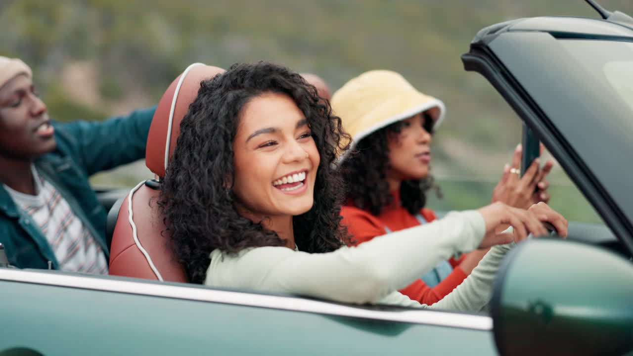 Friends on a road trip in a convertible