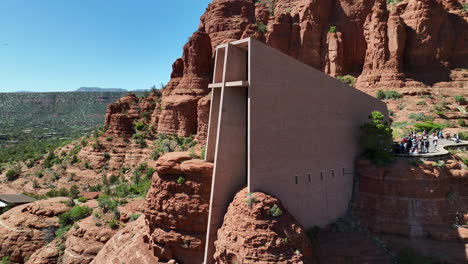 impressive chapel of the holy cross amidst striking sedona red rocks, aerial arc