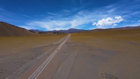 drone shot following a car driving on the ruta de los seismiles in catamarca, argentina