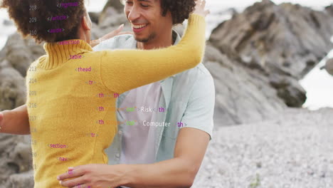 animation of data processing over african american couple embracing on beach