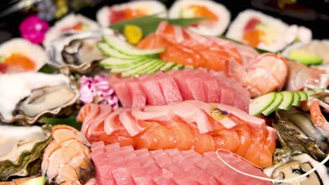 a colorful display of assorted sushi and sashimi.