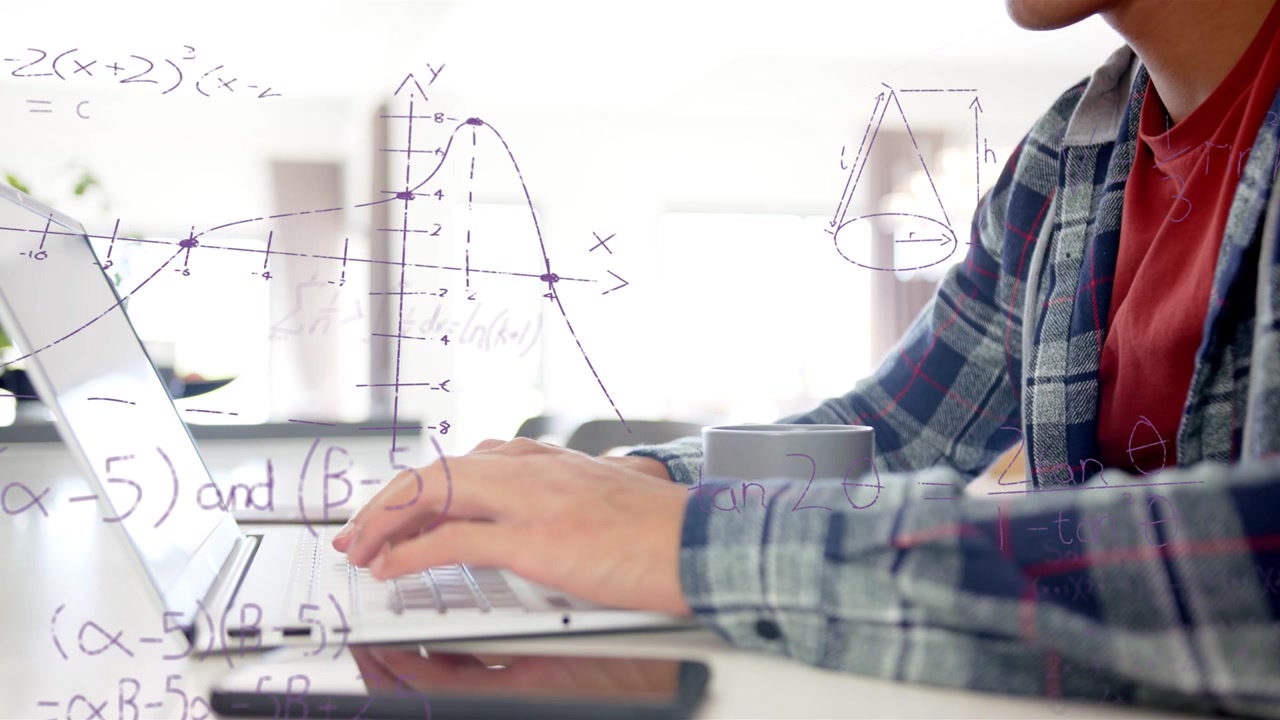 Studente che posa le mani sulla tastiera, digitando sul laptop e rivelando grafici e formule per l'istruzione