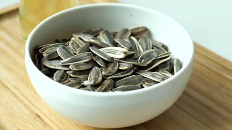 sunflower seeds in a white bowl