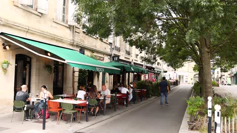 people enjoying a café on a bordeaux street