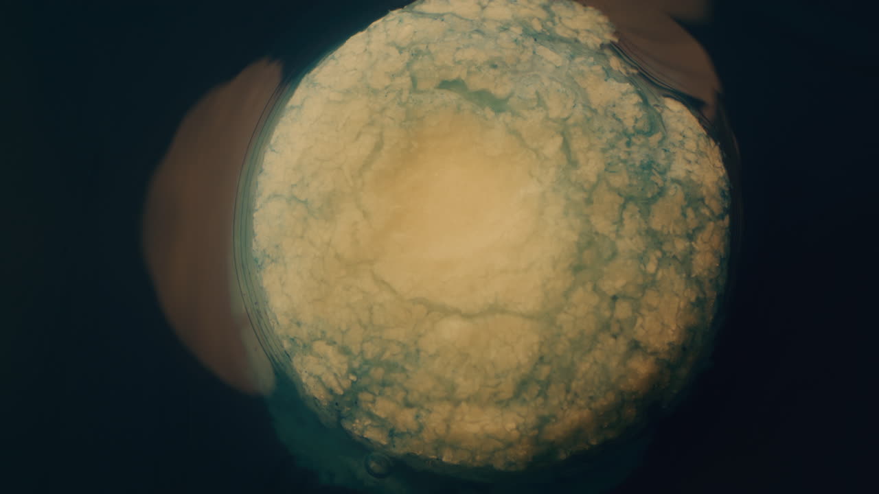 Close up view of a round, textured, light blue object.