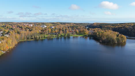 aerial view of a town near a lake in autumn