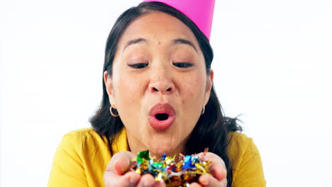 party, woman face and blowing confetti in studio