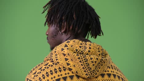 young handsome african man looking back