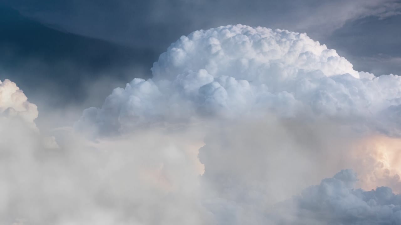 thunderstorm in thick clouds in sunset sky, nature background