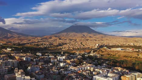 Arequipa-cityscape-and-volcano-moving-forward-drone