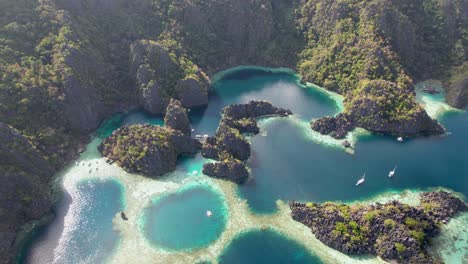 4k drone video of twin lagoon, the popular tourist spot near coron in palawan, philippines