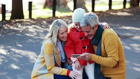 Parents-and-son-taking-a-selfie-on-mobile-phone-