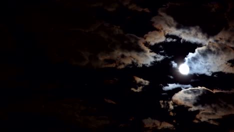 mysterious night sky with full dramatic moon clouds in the moon light moon.