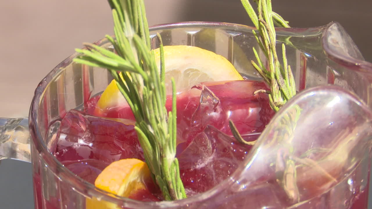Refreshing Red Drink with Lemon, Orange and Rosemary